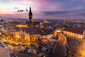 Naklejka premium Sibiu, Transylvania, Romania central square at sunset.