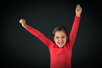 Beautiful girl doing different expressions in different sets of clothes: arms raised