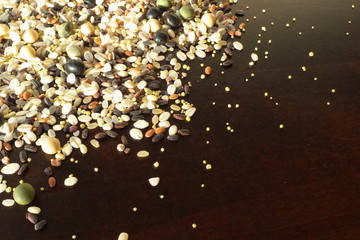 Cereals and beans on wood background