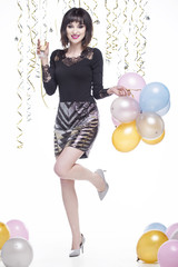 Fototapeta premium Beautiful woman elegantly dressed drinking champagne at the event