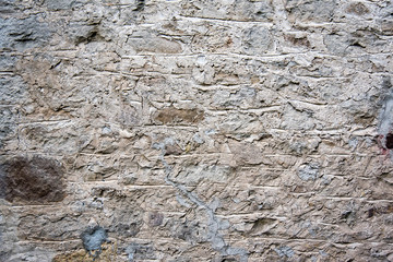 Rough old aged stone and concrete wall