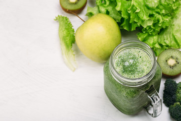 Fresh green smoothie on white background. Super food, detox and healthy food.