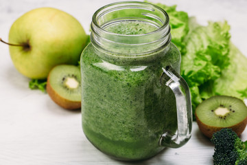 Fresh green smoothie on white background. Super food, detox and healthy food.