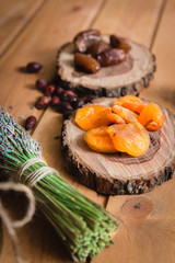 dried dates and apricots on wooden plates