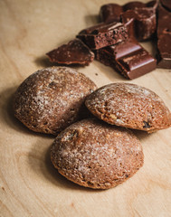 Stacked chocolate chip cookies on wooden board