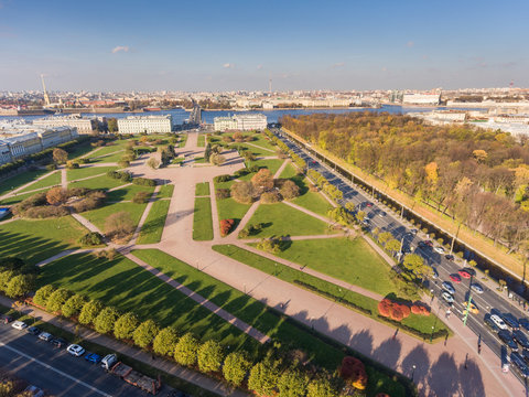 Russia, Saint-Petersburg, 24 October 2016: Aerial view of autumn panorama field of Mars, Trinity bridge, Peter and Paul fortress, roofs, Summer garden, shadows of trees, Neva river