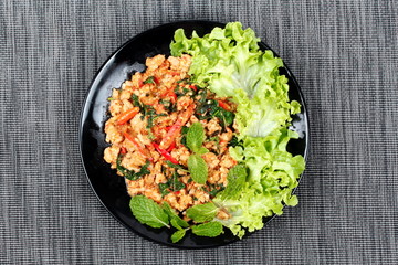 Fried spicy basil with minced pork topped lettuce.