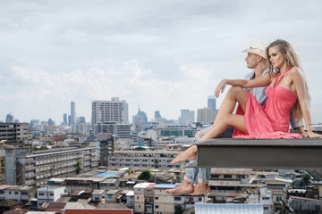Fototapeta na wymiar Portrait of loving couple on the background of beautiful big city