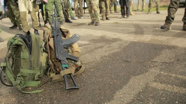 militias are fighting. Men in camouflage with guns and playing airsoft. war
