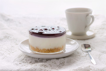 Blueberry cheese cakes served in glass ramekins