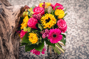 Bouquet of sun flowers and roses