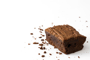 Chocolate brownie with chocolate syrup isolated on white background
