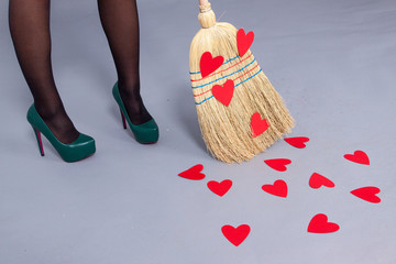  Beautiful woman posing with red hearts made of paper on the bro