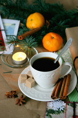 A cup of hot coffee on the background of Christmas decorations..