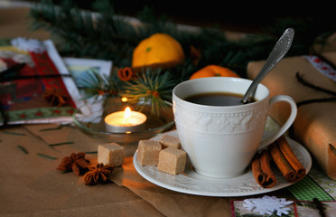 A cup of hot coffee on the background of Christmas decorations..