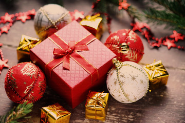 Christmas balls, gift boxes, bijouterie and fir tree branch 