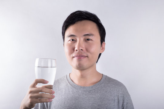 Asian man drinking water