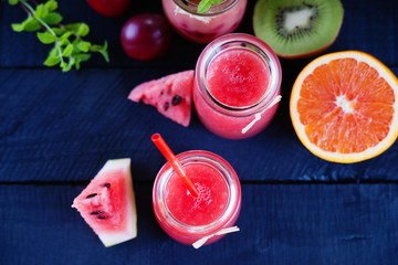 Jars with smoothies and fruits 