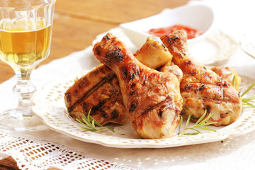Dinner background.Grilled chicken legs with rosemary. 