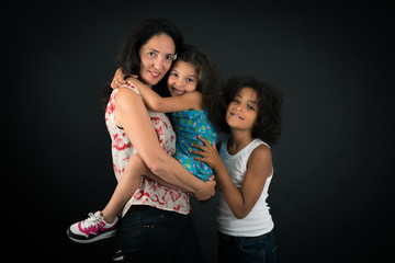 Beautiful family doing different expressions in different sets of clothes: love
