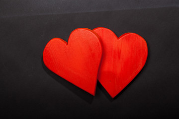 Holidays gift and heart on a black background. Valentines day