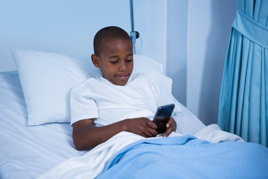 Patient using mobile phone in ward