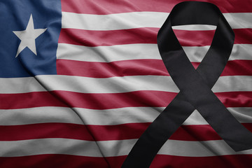 flag of liberia with black mourning ribbon