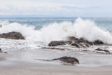 Waves crashing to rocks montezuma beach