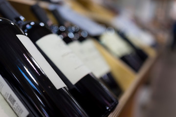 Naklejka premium Wine bottles in wooden crates on display