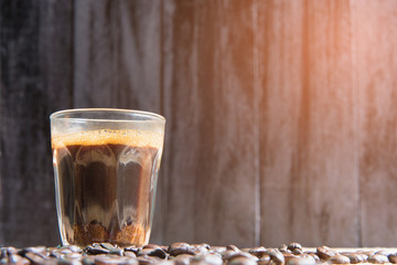 espresso in a glass on wooden table