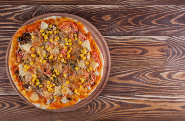 Fresh pizza isolated on wood desk