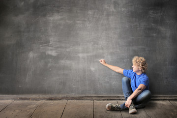 Guy writing on a blackboard