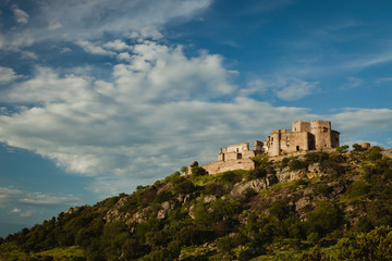 Fototapeta na wymiar Beautiful Spanish old castle over a hill and a beautiful sky