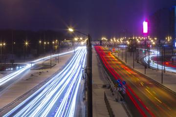 Fototapeta premium Night road in the city with car the light trails