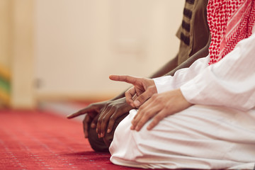 Two religious muslim man praying together inside the mosque © FS-Stock
