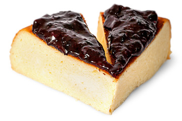 Two pieces of cheese casseroles with currant jam