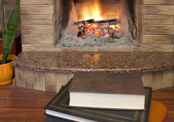 books and birning fireplace