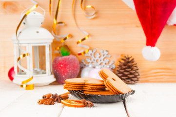 Christmas background with gingerbread cookies, candlelight and S