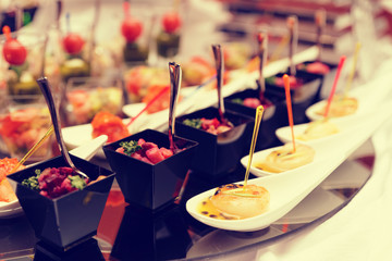 Various snacks on table, toned