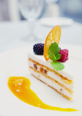 Cassata dessert on restaurant table, toned