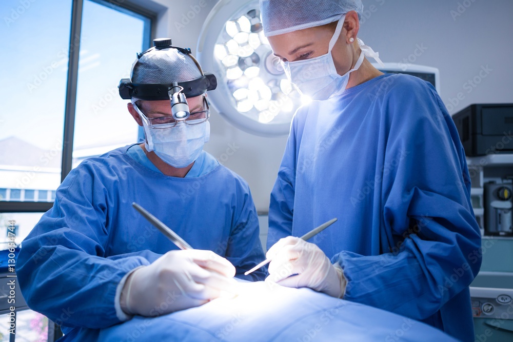 Poster Surgeons performing operation in operation theater