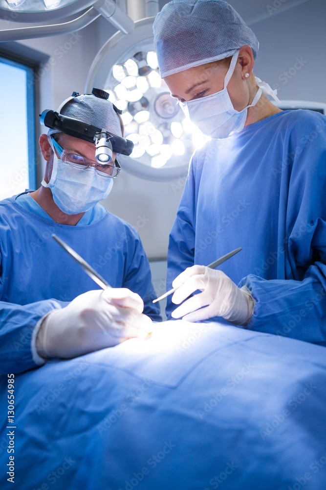 Poster surgeons performing operation in operation theater
