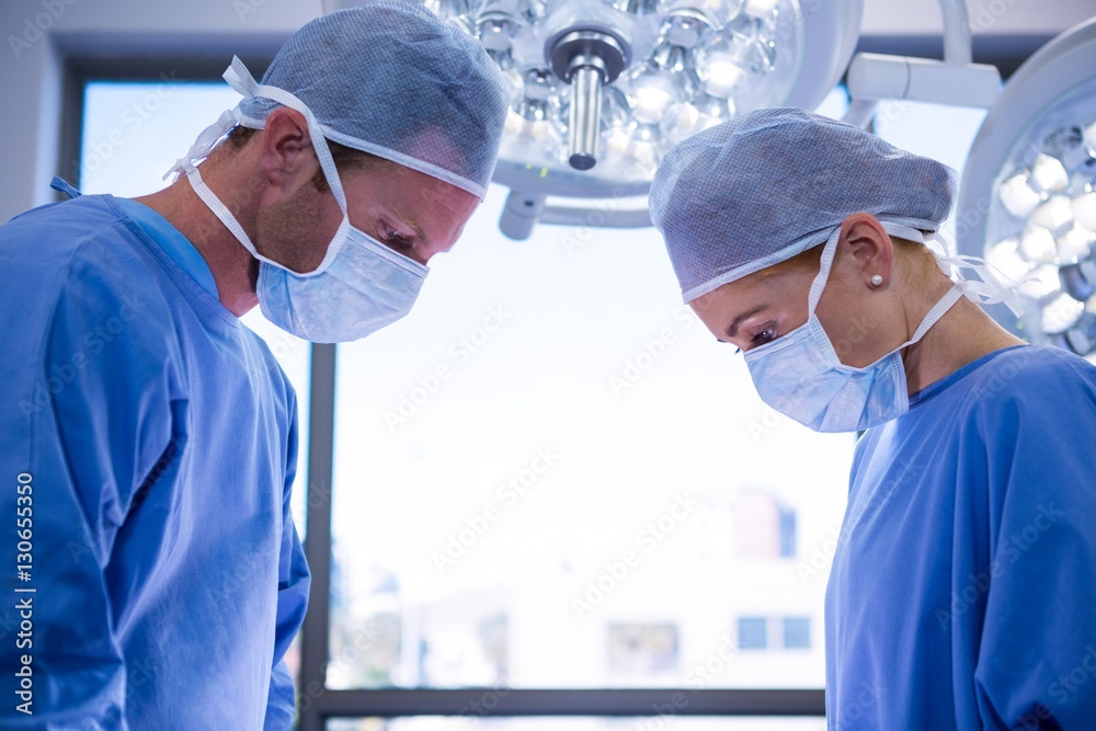 Poster surgeons performing operation in operation theater