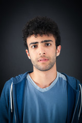 Obraz premium Handsome man doing different expressions in different sets of clothes: angry