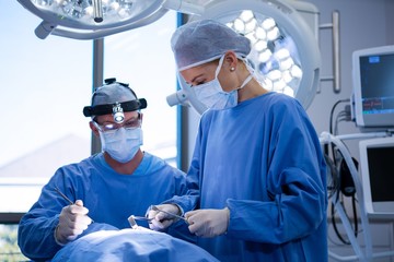 Surgeons performing operation in operation theater