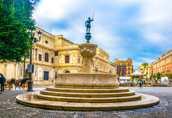 view of a fountain situated ion the plaza de san francisco in front of the town hall in sevilla