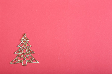 Fototapeta na wymiar Golden christmas fir tree decoration on glitter background