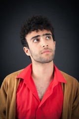 Handsome man doing different expressions in different sets of clothes: thinking