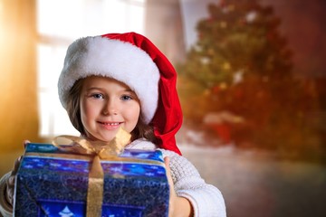 Child giving a christmas present.