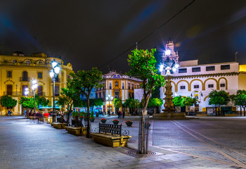 night view of the plaza de la virgen in the spanish city sevilla